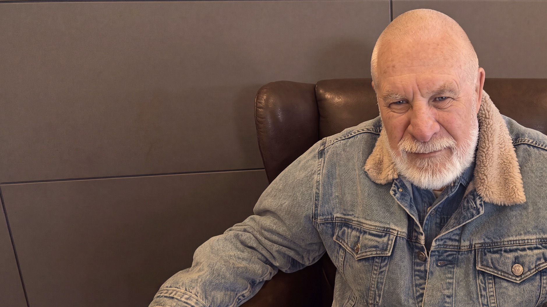 Vishrant seated in a denim jacket, looking to camera
