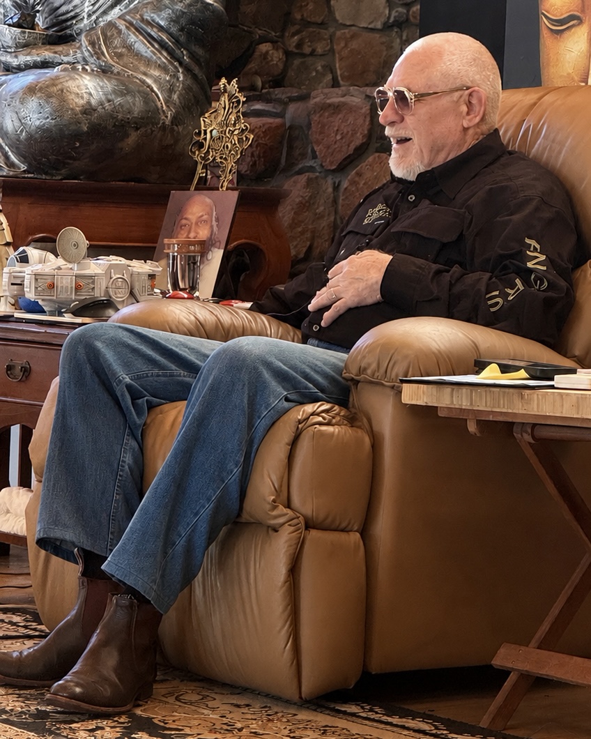 Vishrant laughing in his armchair during a session.
