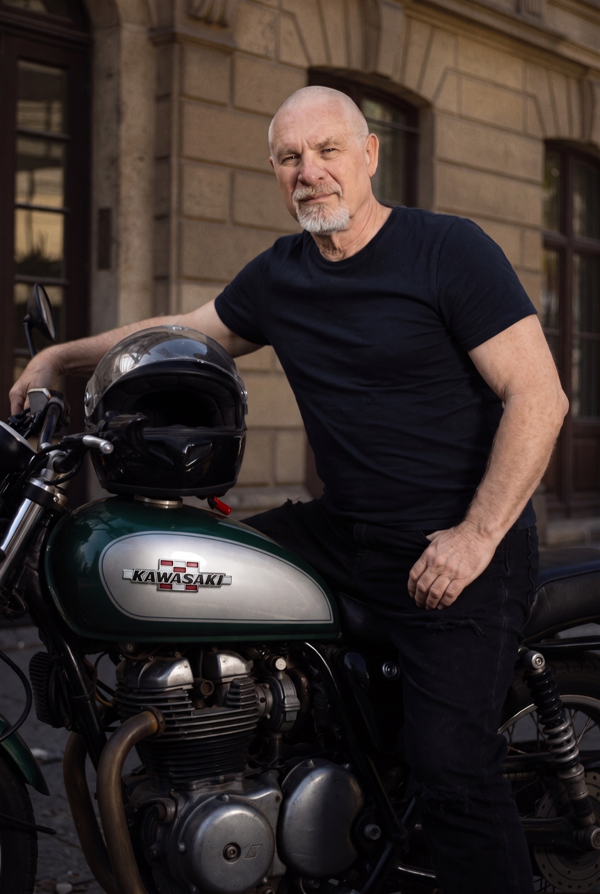 Vishrant seated on his motorcycle, looking at the camera.