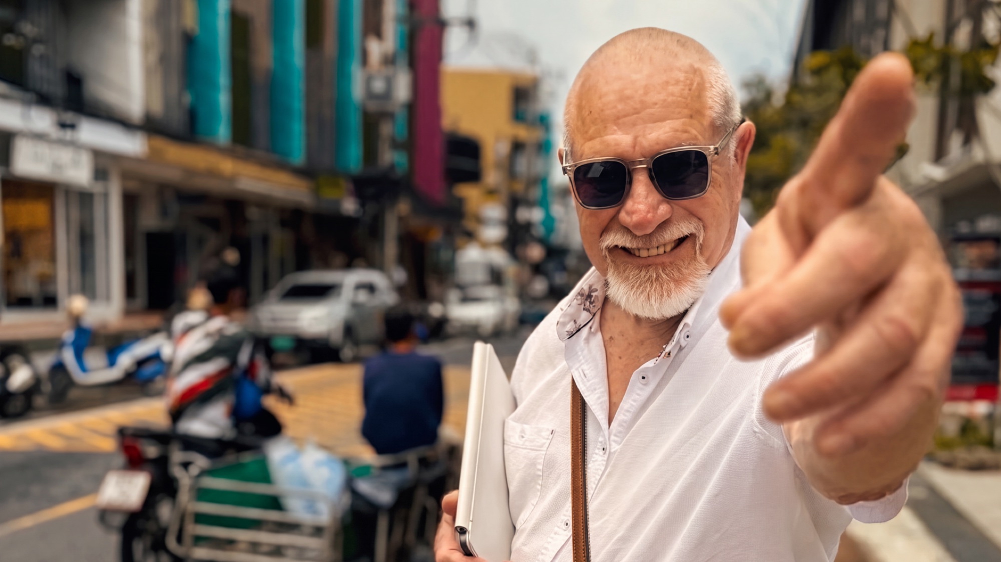 Vishrant on the street, reaching a hand to camera.